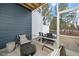 Cozy screened porch with comfortable seating for outdoor relaxation and entertainment at 1000 Pyrenees Way, Cary, NC 27519