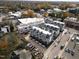 Aerial view of a newly developed residential area with modern townhomes, landscaping and street view at 1007 Hundley Pl, Durham, NC 27701