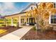 Charming exterior with a stone facade and inviting front porch with rocking chairs at 1009 Grey Flint Pl, Mebane, NC 27302