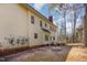 Back exterior featuring a deck, light colored siding, and multiple windows offering natural light at 101 Rustic Wood Ln, Cary, NC 27518