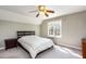 Cozy bedroom features a ceiling fan and a window providing natural light at 101 Rustic Wood Ln, Cary, NC 27518
