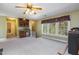 Bonus room featuring wet bar, natural light, neutral colored walls and carpeted floors at 101 Rustic Wood Ln, Cary, NC 27518