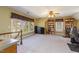 Spacious bonus room has natural light, built in bookshelves and neutral colored carpet at 101 Rustic Wood Ln, Cary, NC 27518
