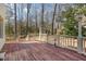 Spacious wooden deck with white railings, providing an inviting outdoor living space at 101 Rustic Wood Ln, Cary, NC 27518