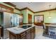 Kitchen with stainless steel appliances, center island, breakfast table, and access to the living room at 101 Rustic Wood Ln, Cary, NC 27518