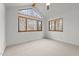 Bedroom featuring a ceiling fan and large windows at 1011 Oxbow Crossing Rd, Chapel Hill, NC 27516