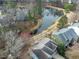 Aerial view of a house with a pond in the backyard at 104 Deep Gap Run, Cary, NC 27519