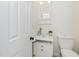 Bathroom featuring a modern glass bowl sink, vanity with storage and white walls at 104 Deep Gap Run, Cary, NC 27519