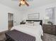 Bright bedroom with carpet flooring, ceiling fan, and ensuite bathroom at 104 Deep Gap Run, Cary, NC 27519