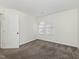 Bright bedroom with two windows and neutral carpet at 104 Deep Gap Run, Cary, NC 27519