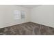 Spacious bedroom featuring neutral walls, two windows and neutral carpet at 104 Deep Gap Run, Cary, NC 27519