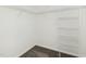 Walk-in closet with shelving and carpeted floor at 104 Deep Gap Run, Cary, NC 27519