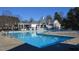 Well-maintained community pool with lifeguard chair and clubhouse, promising residents a relaxing and fun space at 104 Deep Gap Run, Cary, NC 27519