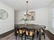 Elegant dining room features a wooden table, six chairs, chandelier, and stylish decor at 104 Deep Gap Run, Cary, NC 27519