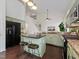Spacious kitchen with green cabinets, granite countertops, and a center island with bar seating at 104 Deep Gap Run, Cary, NC 27519
