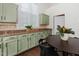 Eat in kitchen with ample cabinets, granite counter tops and a window with lots of natural light at 104 Deep Gap Run, Cary, NC 27519