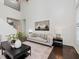 Bright living room with high ceilings, a comfortable sofa, and modern decor at 104 Deep Gap Run, Cary, NC 27519