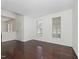 Empty living room with hardwood floors, and large bright windows at 104 Deep Gap Run, Cary, NC 27519