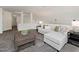 Comfortable living room with a light gray couch, coffee table, and plush gray carpet at 104 Deep Gap Run, Cary, NC 27519