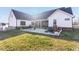Spacious backyard featuring a patio, covered porch, and a well-maintained lawn perfect for outdoor living at 107 Crescent Hill Ln, Rougemont, NC 27572