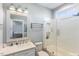 Bright bathroom with a shower over tub, subway tile, and a modern vanity at 107 Crescent Hill Ln, Rougemont, NC 27572