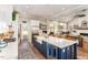 Bright eat-in kitchen with a center island, stainless steel appliances, and a view to the living room at 107 Crescent Hill Ln, Rougemont, NC 27572