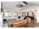Spacious living room with high ceilings, a ceiling fan, and an open layout connecting to the kitchen at 107 Crescent Hill Ln, Rougemont, NC 27572