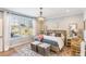 Beautiful main bedroom with a chandelier, large window, and stylish decor at 107 Crescent Hill Ln, Rougemont, NC 27572