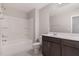 Bathroom featuring a shower-tub combo, toilet, vanity with mirror, and gray tile flooring at 1077 Kafka Dr, Fuquay Varina, NC 27526