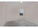 Neutral bedroom with carpeted floor, window, and overhead lighting at 1077 Kafka Dr, Fuquay Varina, NC 27526
