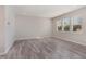Bright and airy bedroom featuring hardwood floors and ample natural light at 1077 Kafka Dr, Fuquay Varina, NC 27526