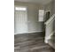 Welcoming entryway with hardwood floors and a staircase to the upper level at 1077 Kafka Dr, Fuquay Varina, NC 27526