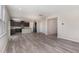 Open concept living space with hardwood floors connecting the kitchen and living room at 1077 Kafka Dr, Fuquay Varina, NC 27526