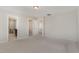 Carpeted main bedroom with multiple doorways to the bathroom and closet at 1077 Kafka Dr, Fuquay Varina, NC 27526
