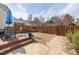 Backyard with a wooden deck, patio, grass area, and a privacy fence at 10813 Laurnet Pl, Raleigh, NC 27614