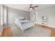 Bedroom featuring hardwood floors, a ceiling fan, white furniture, and natural light at 10813 Laurnet Pl, Raleigh, NC 27614