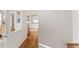 Open-concept hallway with views of living room and kitchen, featuring hardwood floors at 111 Legacy Ln, Durham, NC 27713