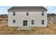 Two-story home featuring a sliding glass door to the backyard patio at 1122 Briar Rose Ln, Durham, NC 27704