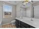 Bright bathroom with double sink vanity with dark cabinets, and shower and tub combo at 1122 Briar Rose Ln, Durham, NC 27704