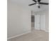 Bright bedroom features neutral carpet and a ceiling fan, illuminated by natural light from the window at 1122 Briar Rose Ln, Durham, NC 27704