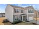 Side angle of a charming gray two-story home with a two-car garage at 1122 Briar Rose Ln, Durham, NC 27704