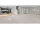 Open living area that features a neutral carpet, and is open to the kitchen at 1122 Briar Rose Ln, Durham, NC 27704