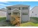 A spacious backyard highlighting a charming deck and stairwell perfect for relaxing or entertaining outdoors at 124 Hemlock Falls Trl # 189, Raleigh, NC 27603