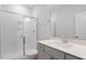 Bright bathroom featuring a glass enclosed shower, modern vanity and white subway tile at 124 Hemlock Falls Trl # 189, Raleigh, NC 27603