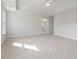 Spacious bedroom with neutral carpet, a ceiling fan, and lots of natural light at 124 Hemlock Falls Trl # 189, Raleigh, NC 27603