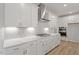 Close up of new kitchen with white cabinetry, subway tile backsplash and stainless steel appliances at 124 Hemlock Falls Trl # 189, Raleigh, NC 27603