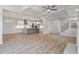 Open-concept floor plan with kitchen island view, coffered ceilings, and natural light at 124 Hemlock Falls Trl # 189, Raleigh, NC 27603