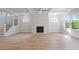 Living room with coffered ceilings, fireplace and an abundance of natural light at 124 Hemlock Falls Trl # 189, Raleigh, NC 27603