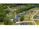 An aerial view of a neighborhood showcasing expansive homes and backyard pools at 132 Edward Booth Ln, Durham, NC 27713
