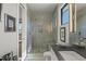 Beautiful bathroom highlighting a glass shower with tile accents, a sleek vanity, and stylish fixtures at 132 Edward Booth Ln, Durham, NC 27713